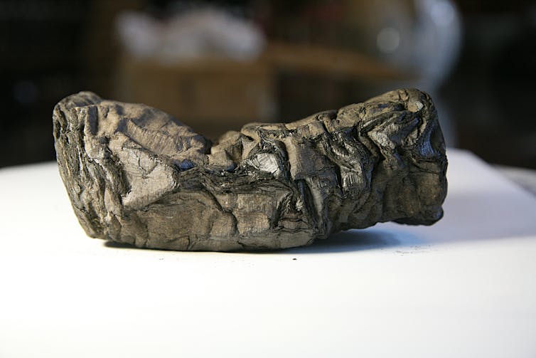 A bulky grey object lies horizontal.