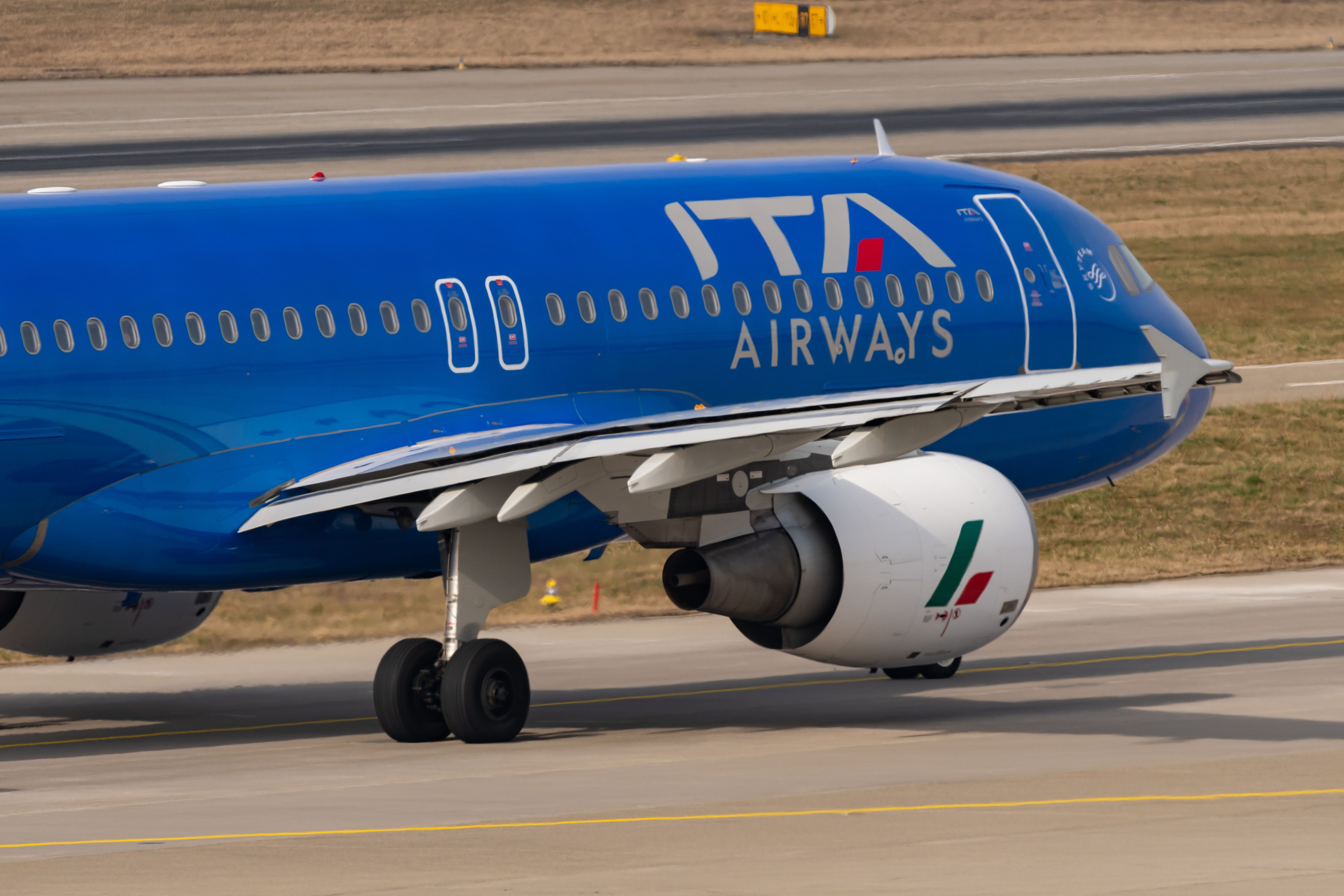 An ITA Airways Airbus A320 on the runway.
