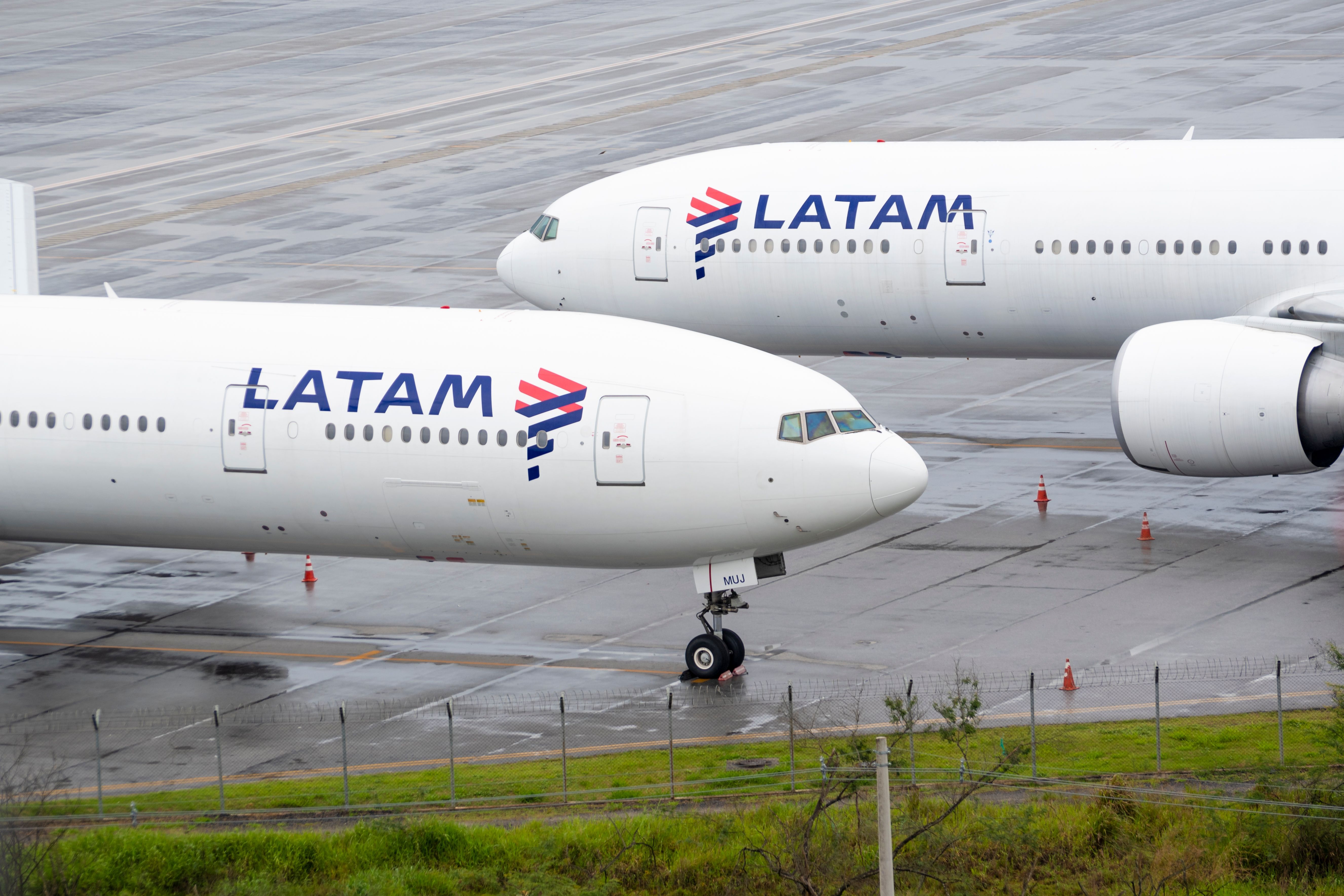 Two LATAM Boeing 777-300s parked 