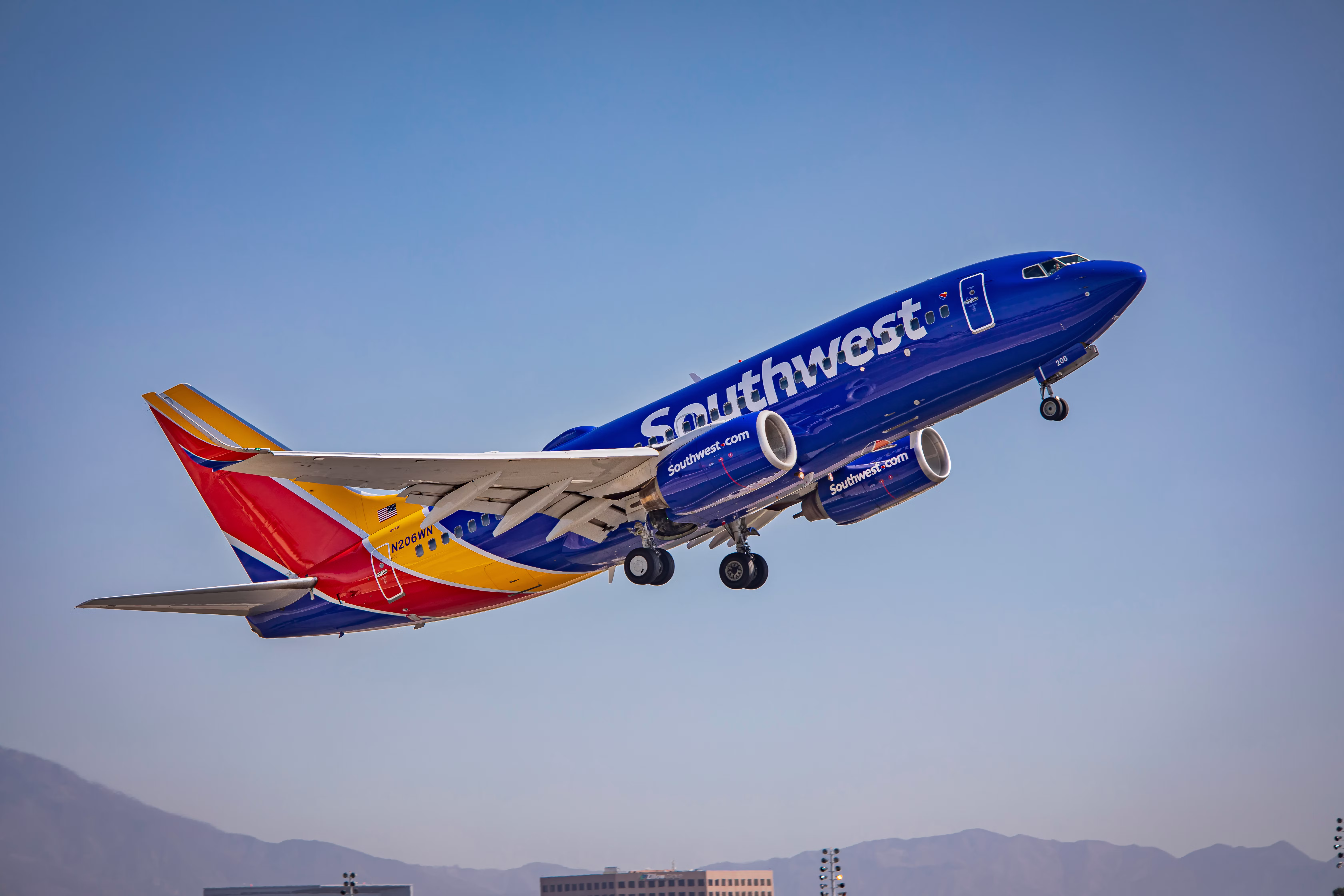 Southwest Airlines Boeing 737-7H4 (N206WN) steep takeoff from John Wayne Airport.