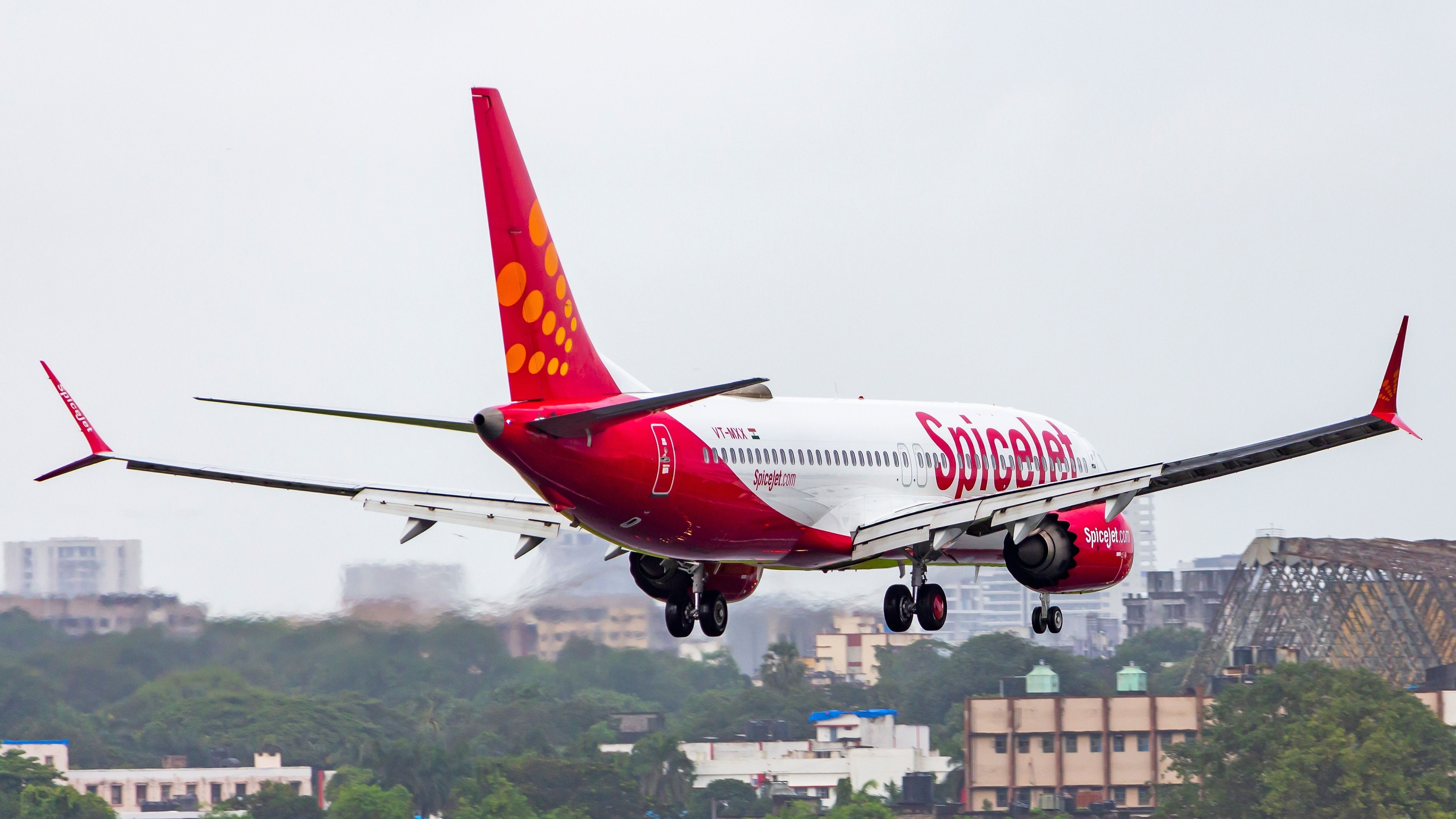 SpiceJet's Boeing 737 MAX 8 approaching the runway at Mumbai Airport.