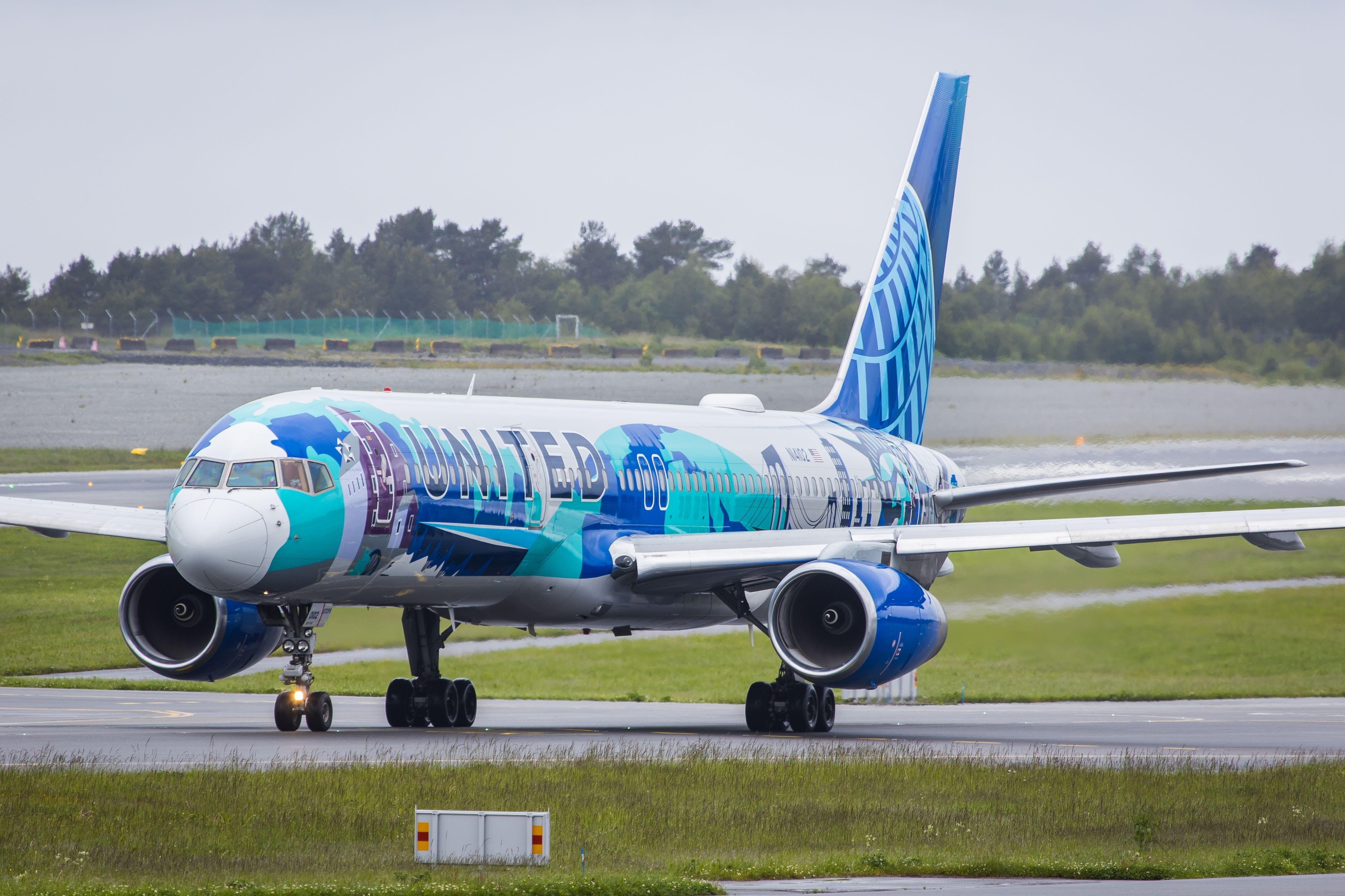 A United Airlines Boeing 757 in a special livery on an airport apron.