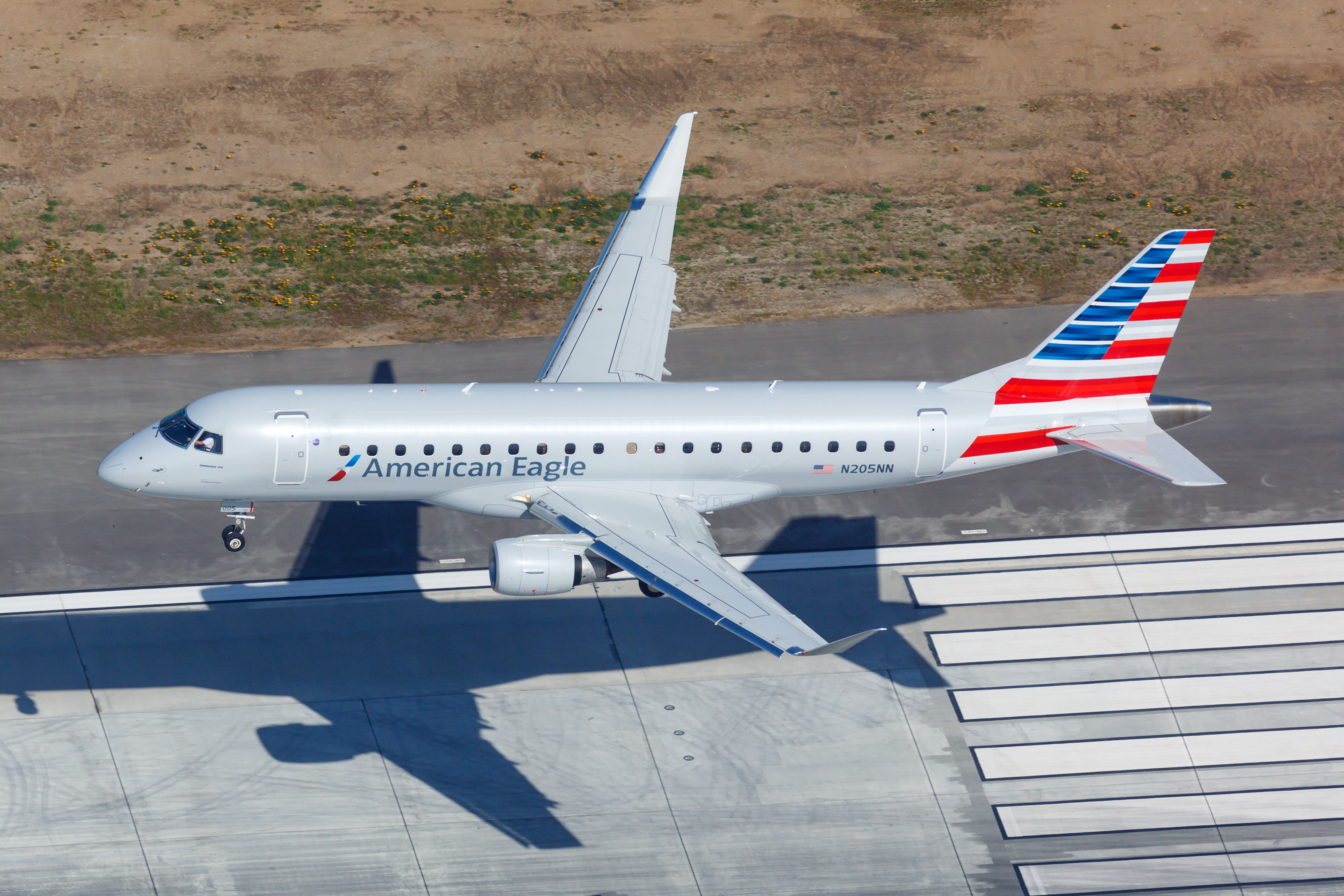 American Eagle Embraer E170 landing at LAX shutterstock_1753465544