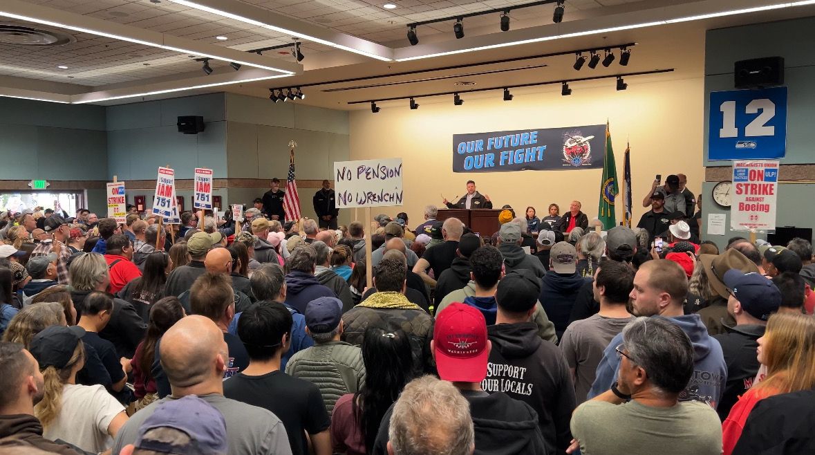 Striking Boeing employees at a town hall