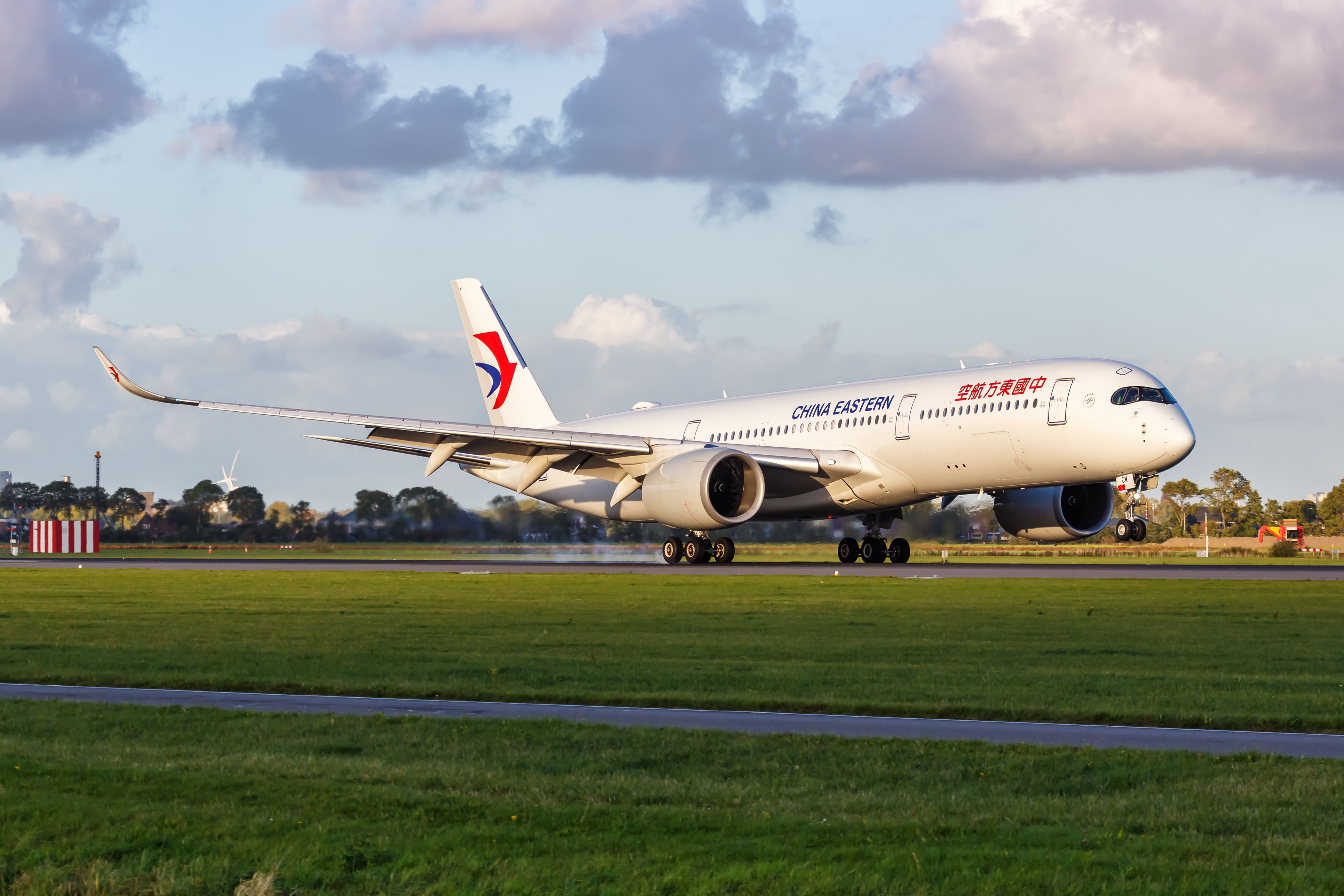 Amsterdam, Netherlands - October 8, 2022: China Eastern Airbus A350-900 airplane at Amsterdam Schiphol airport (AMS) in the Netherlands.