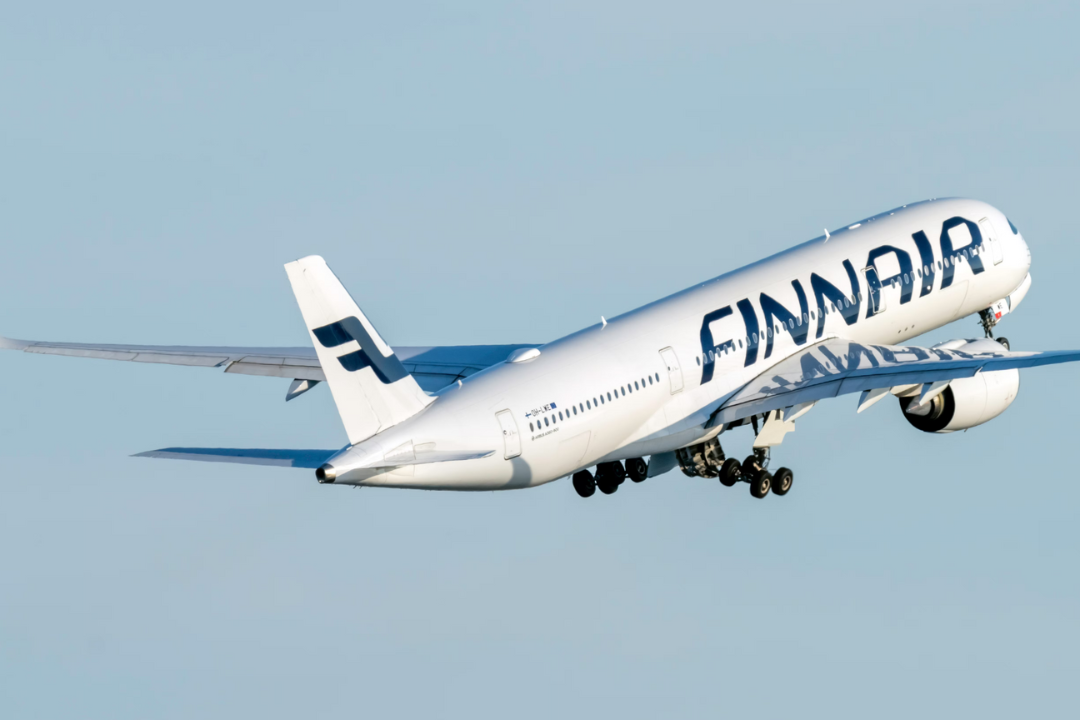 A Finnair Airbus A350-941 flying in the sky