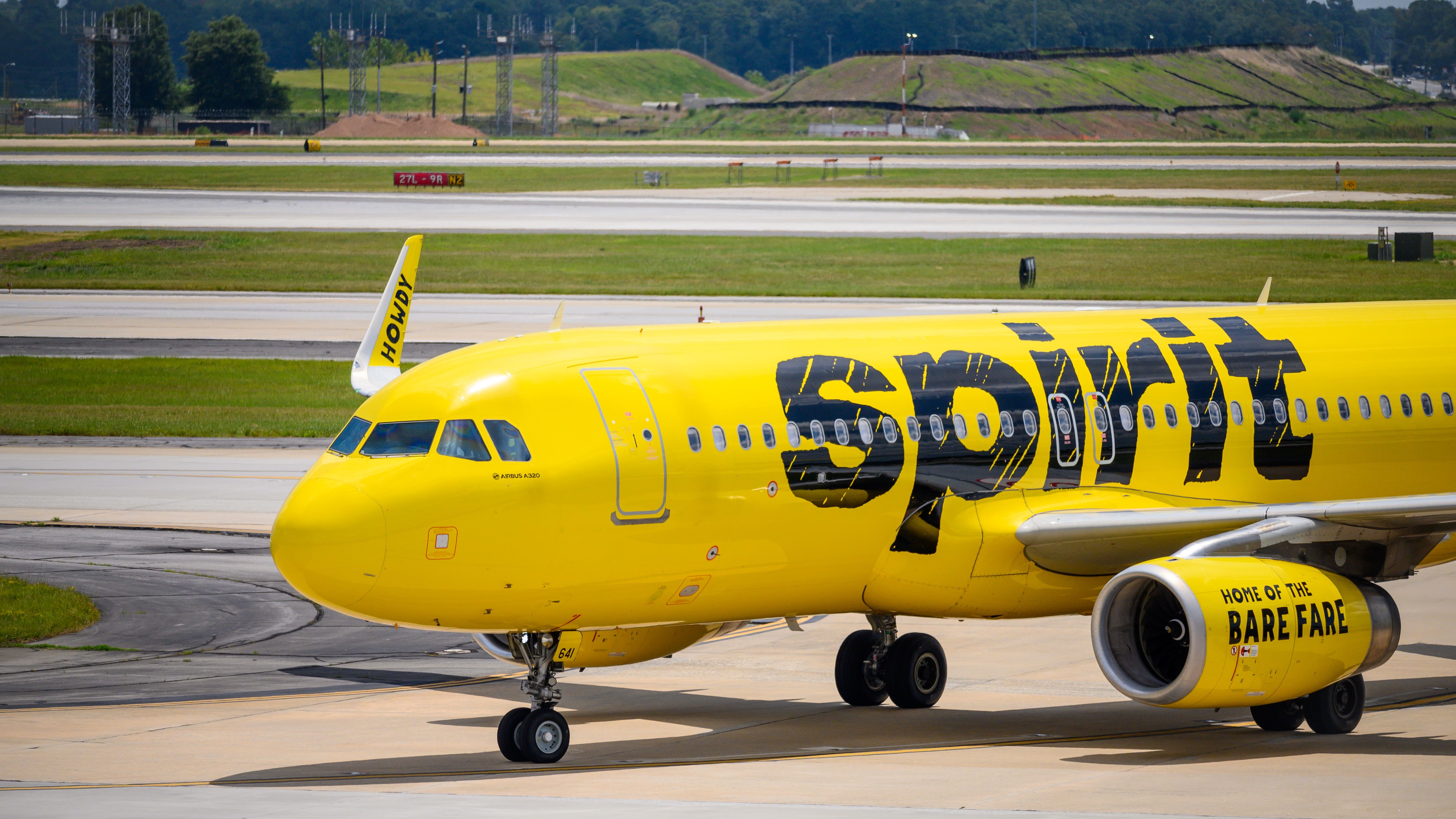A Spirit Airlines Airbus A320 taxiing to the gate.