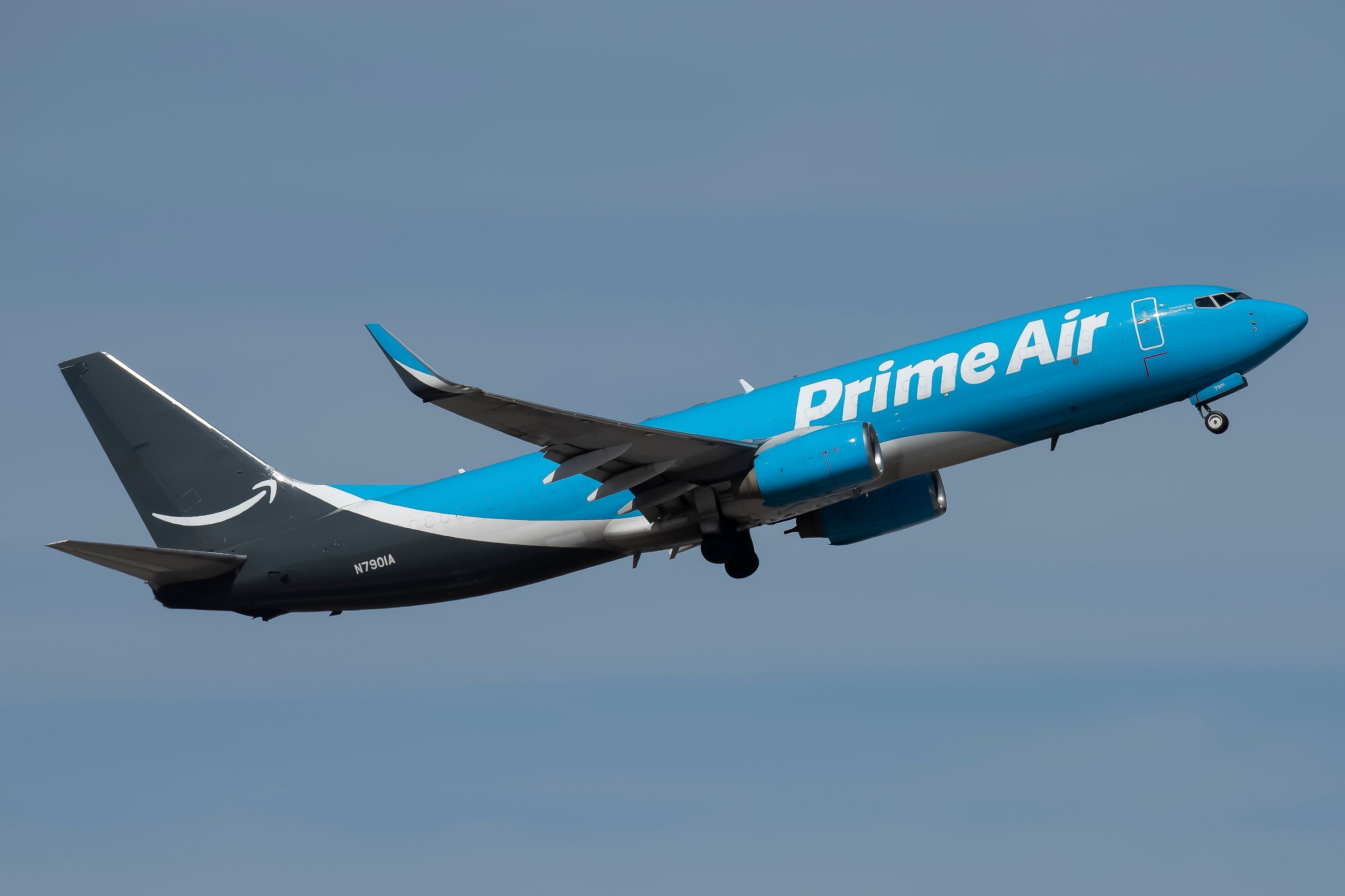 Amazon Air (Prime Air) Boeing 737-800BCF operated by Sun Country Airlines taking off from Phoenix Sky Harbor International Airport.