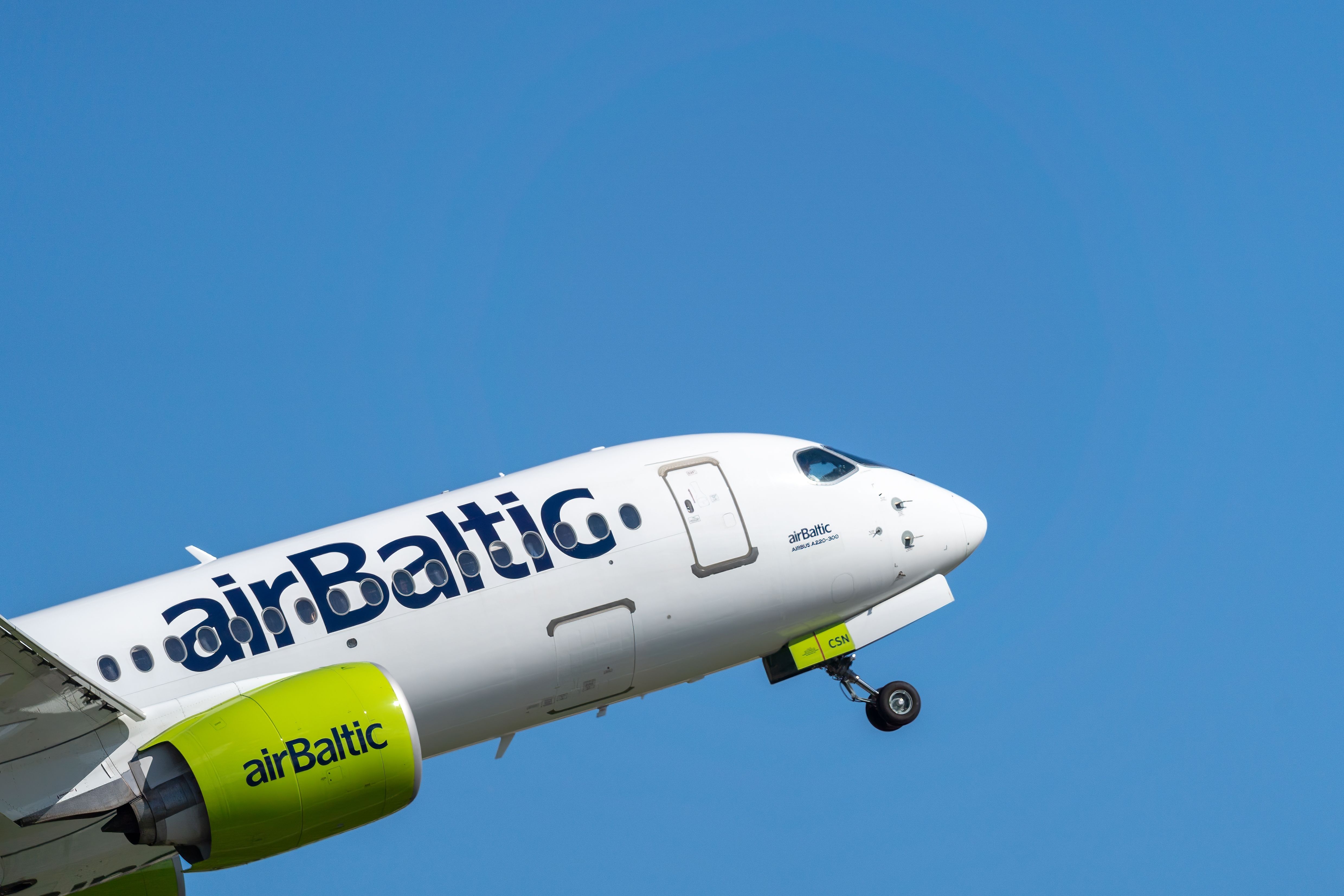 An airbaltic airbus a220 taking off