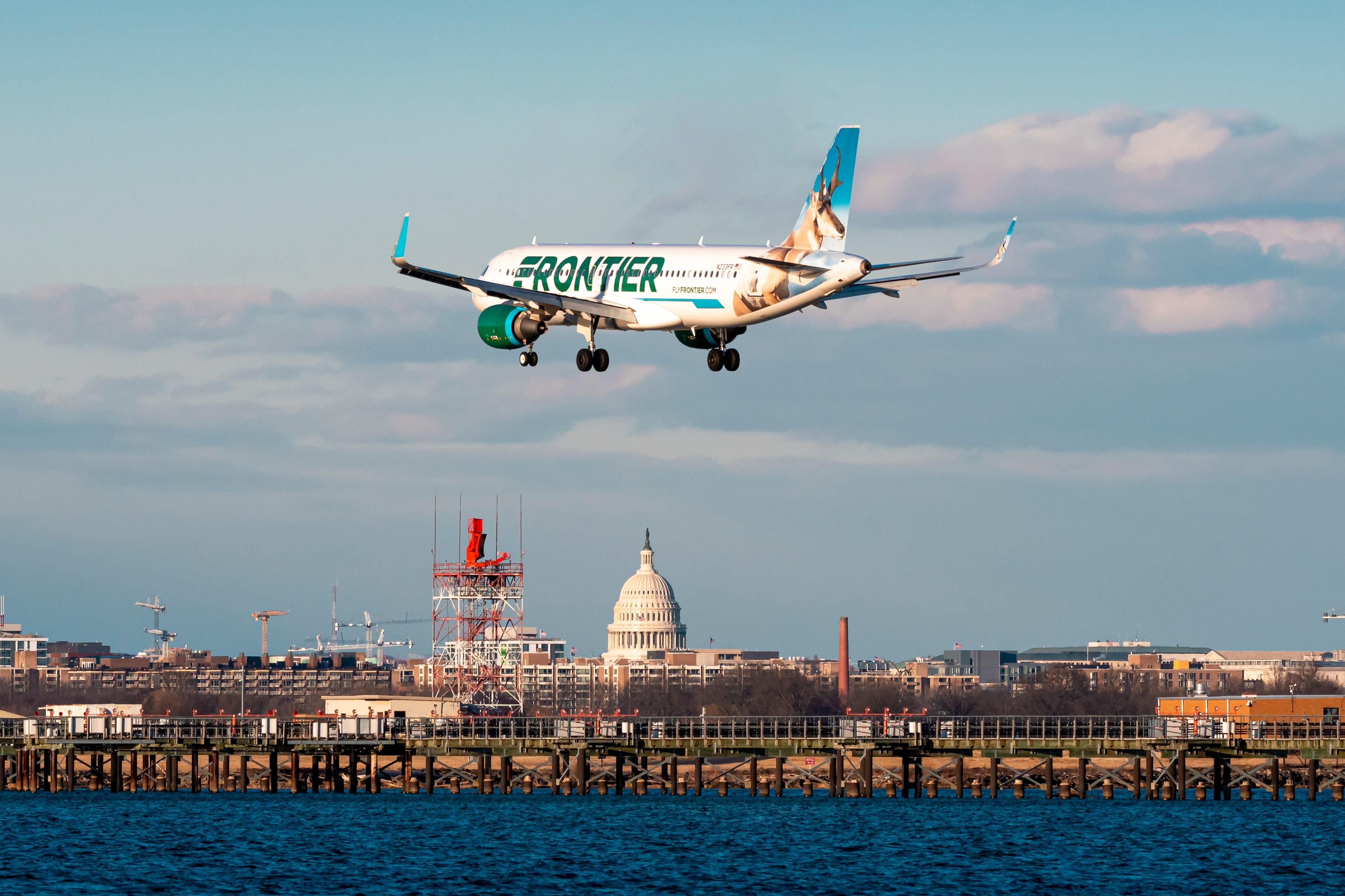 A Frontier Airlines plane landing at Washington DC Reagan National Airport DCA