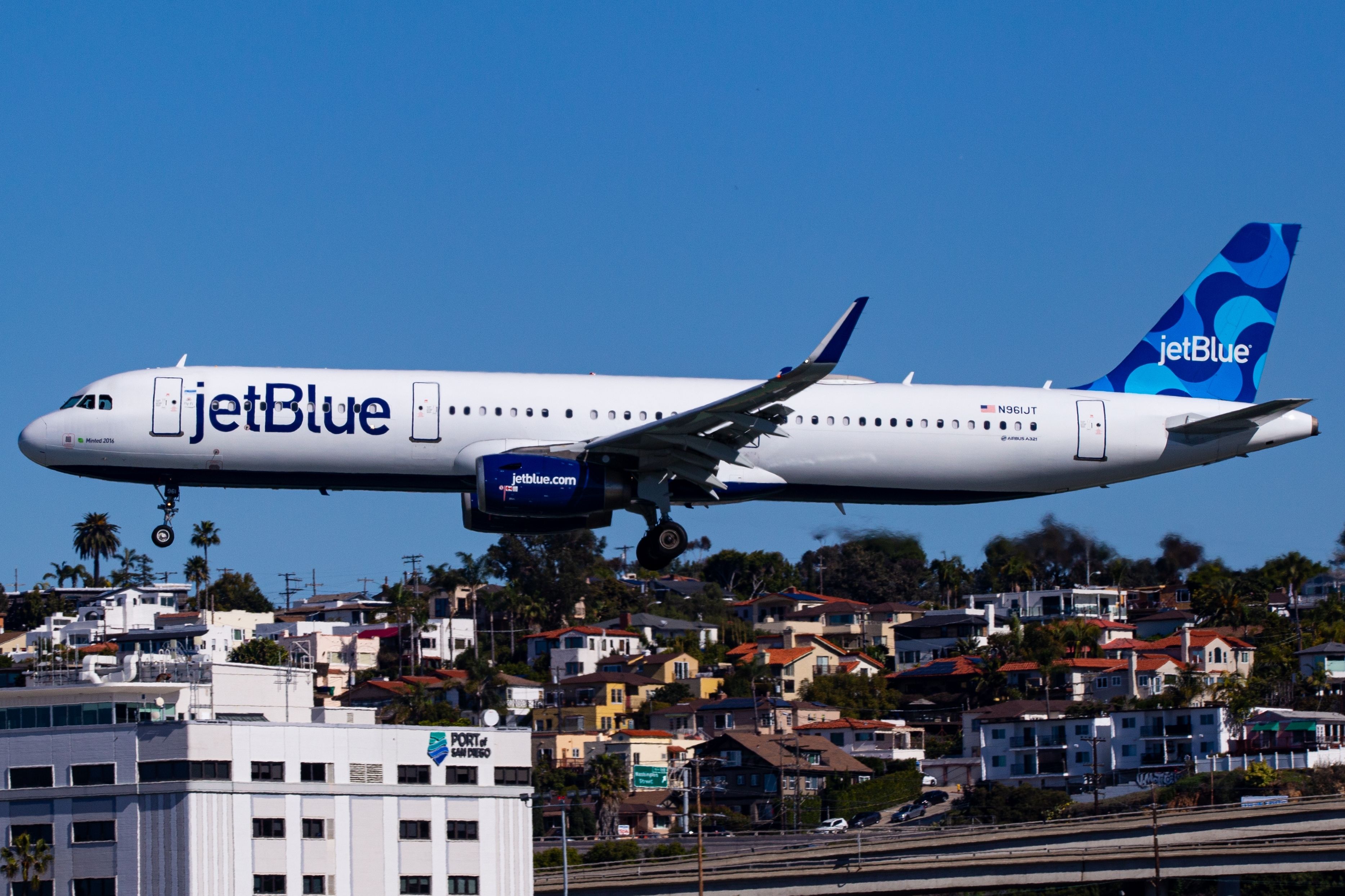 JetBlue Airbus A321 landing at San Diego International Airport SAN shutterstock_2483783347