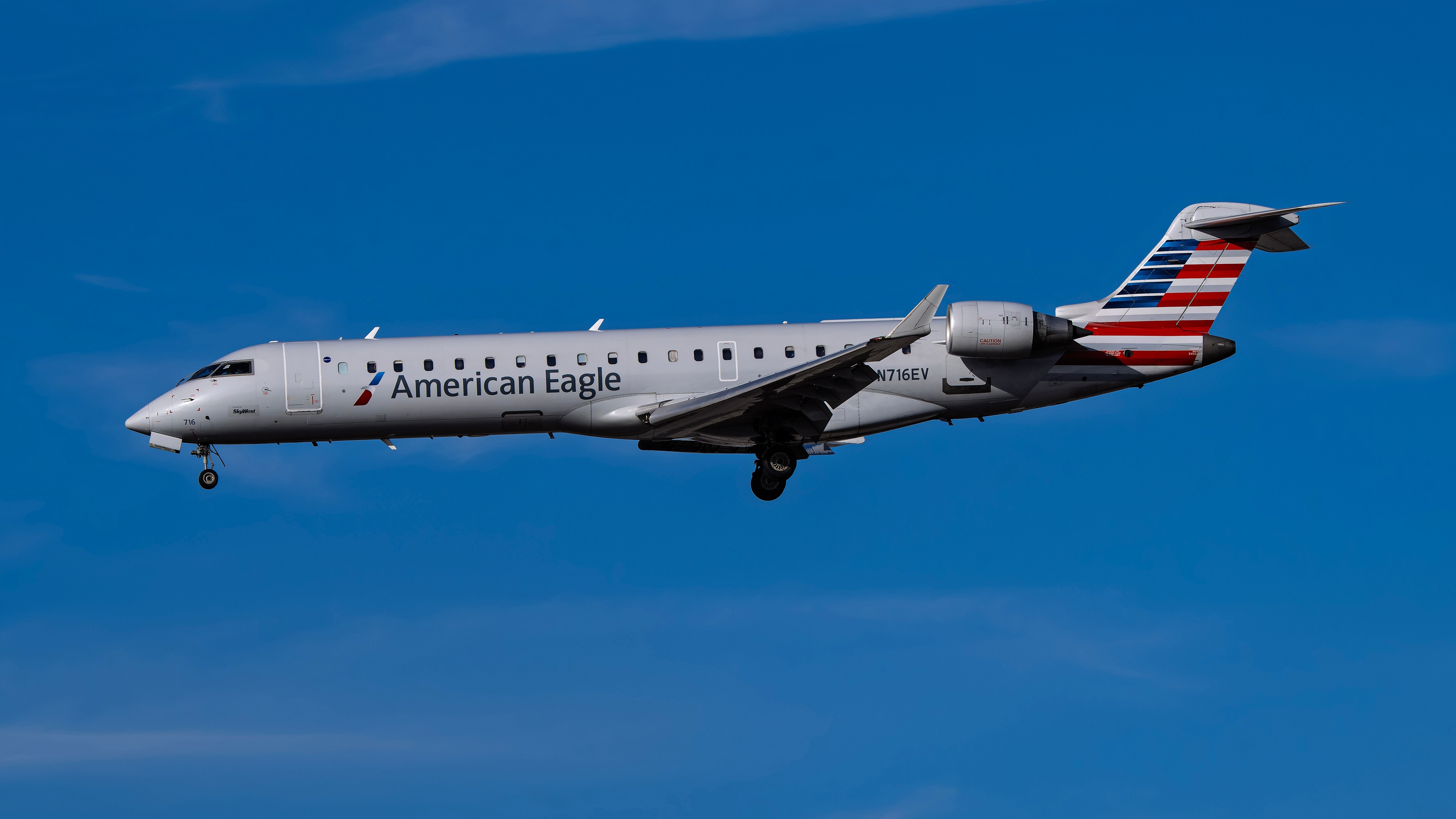 American Eagle Bombardier CRJ700 landing at PHX shutterstock_2566654021