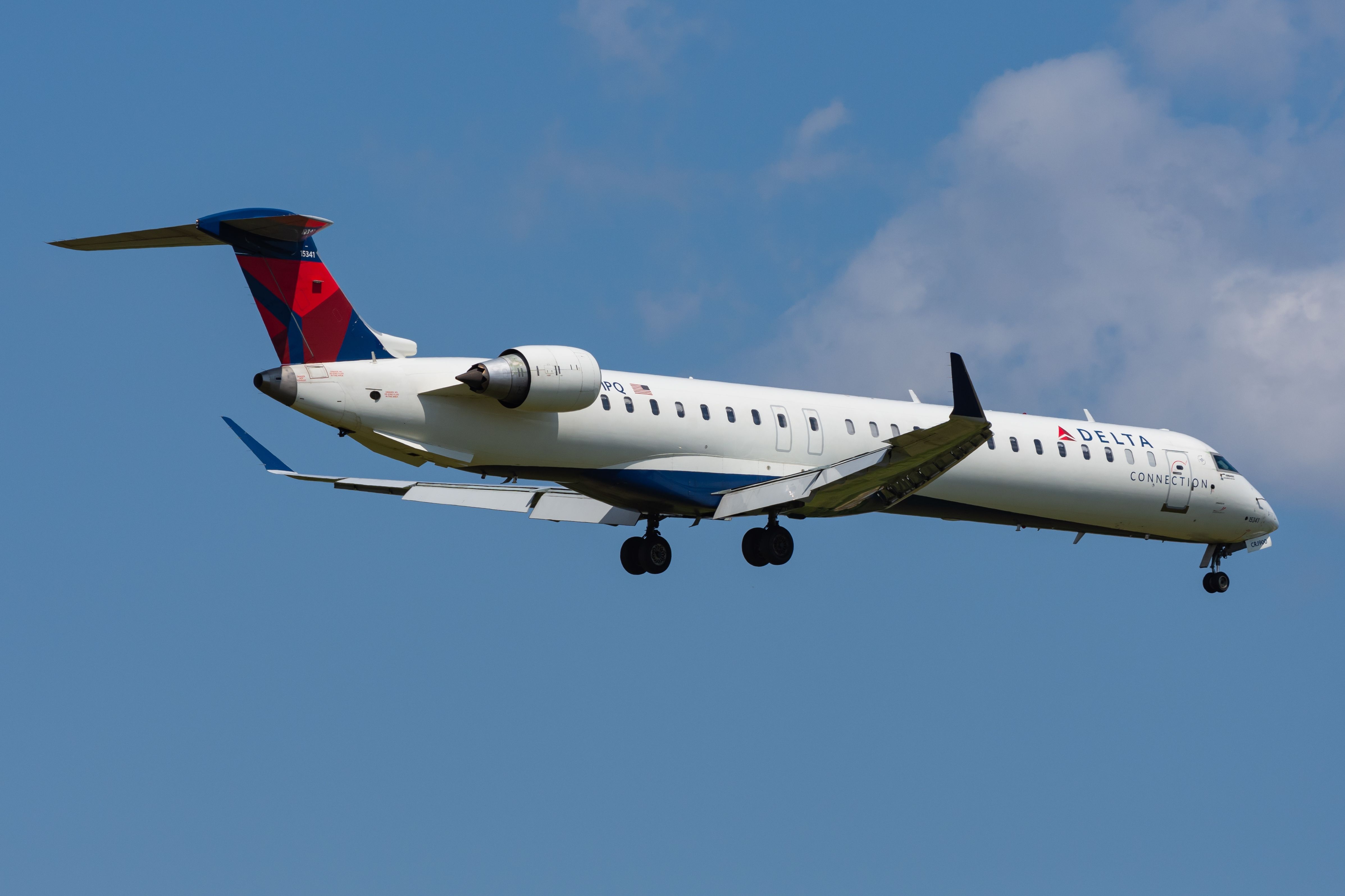 Delta Air Lines Mitsubishi CRJ900 landing at YYZ shutterstock_2408308577