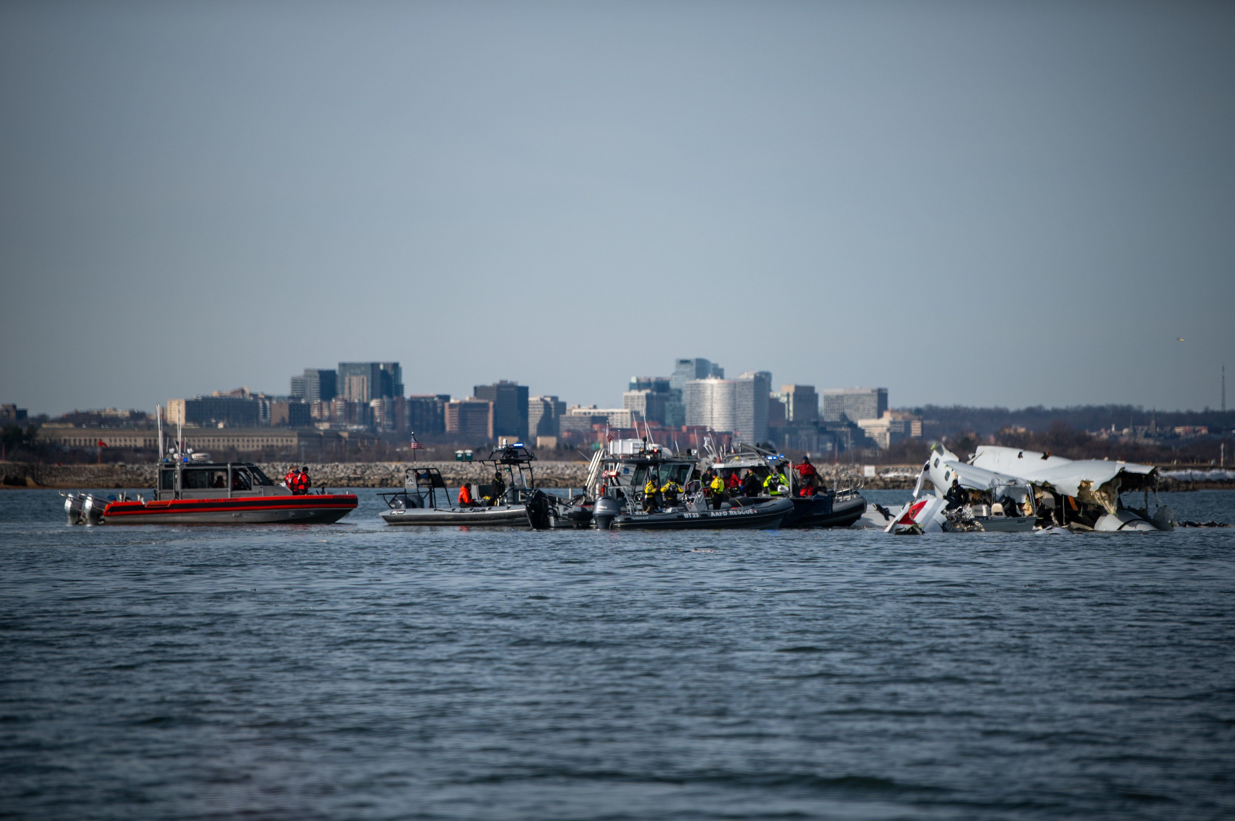 US Coast Guard ships near the crashed PSA Airlines Mitsubishi CRJ700