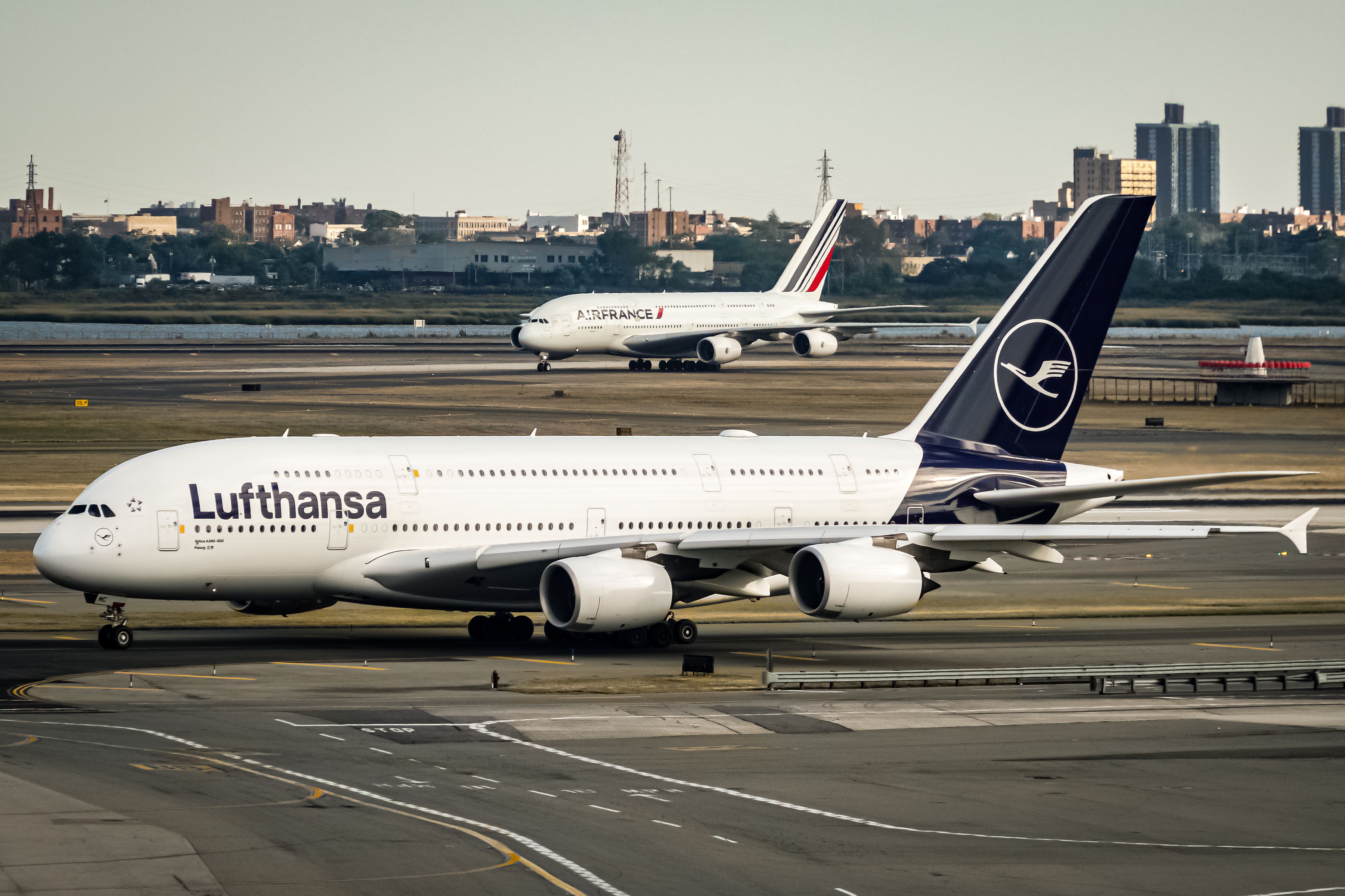 Air France and Lufthansa Airbus A380s at New York John F. Kennedy International Airport JFK shutterstock_1521655091