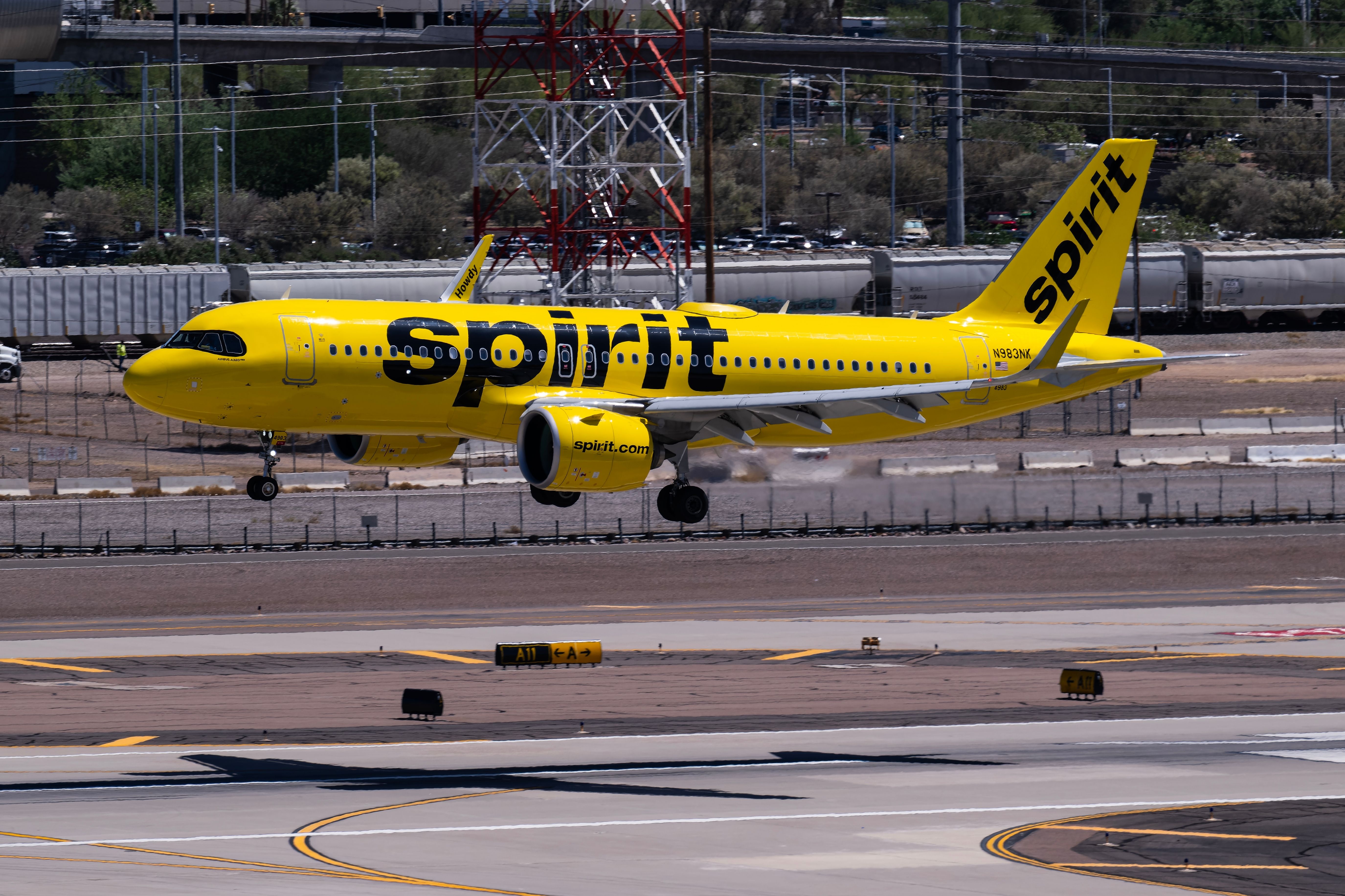 Spirit Airlines Airbus A320neo landing at Phoenix Sky Harbor International Airport PHX shutterstock_2467375619