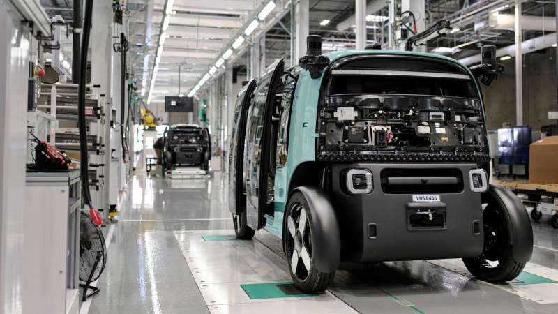 In this undated handout photo provided by Zoox, Zoox robotaxis are assembled at a 220,000-square-foot factory located in Hayward, California. Credit: Zoox via AP Amazon hopes to deliver 10,000 robotaxis annually with new factory, challenging Waymo