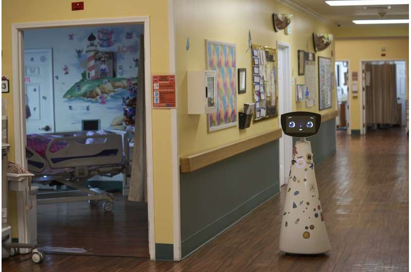 Robin the Robot, developed by Expper Technologies, visits patients' rooms at the HealthBridge Orange Specialty Pediatric Hospital in Orange, Calif., on Friday, Sept. 12, 2025. Credit: AP Photo/Damian Dovarganes A robot programmed to act like a 7-year-old girl works to combat fear and loneliness in hospitals