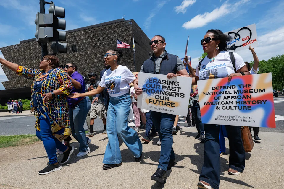 Demonstrators march near the National Museum of African American History and Culture in May. - (Craig Hudson/For The Washington Post)