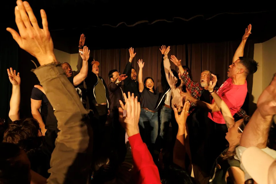 Performers cheer before a show.