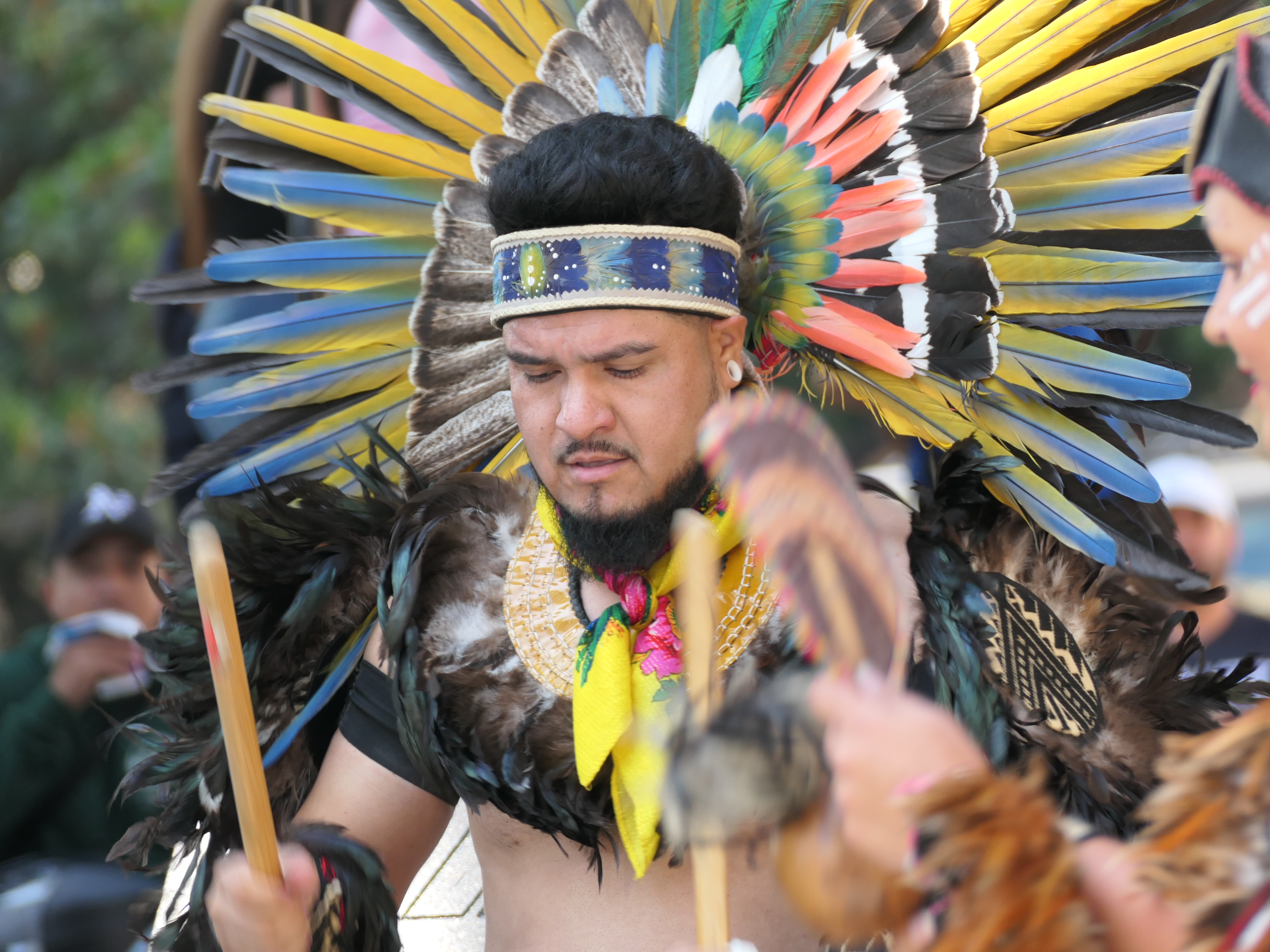 Member of the Calpulli Tonalehqueh Aztec dance group performs at...