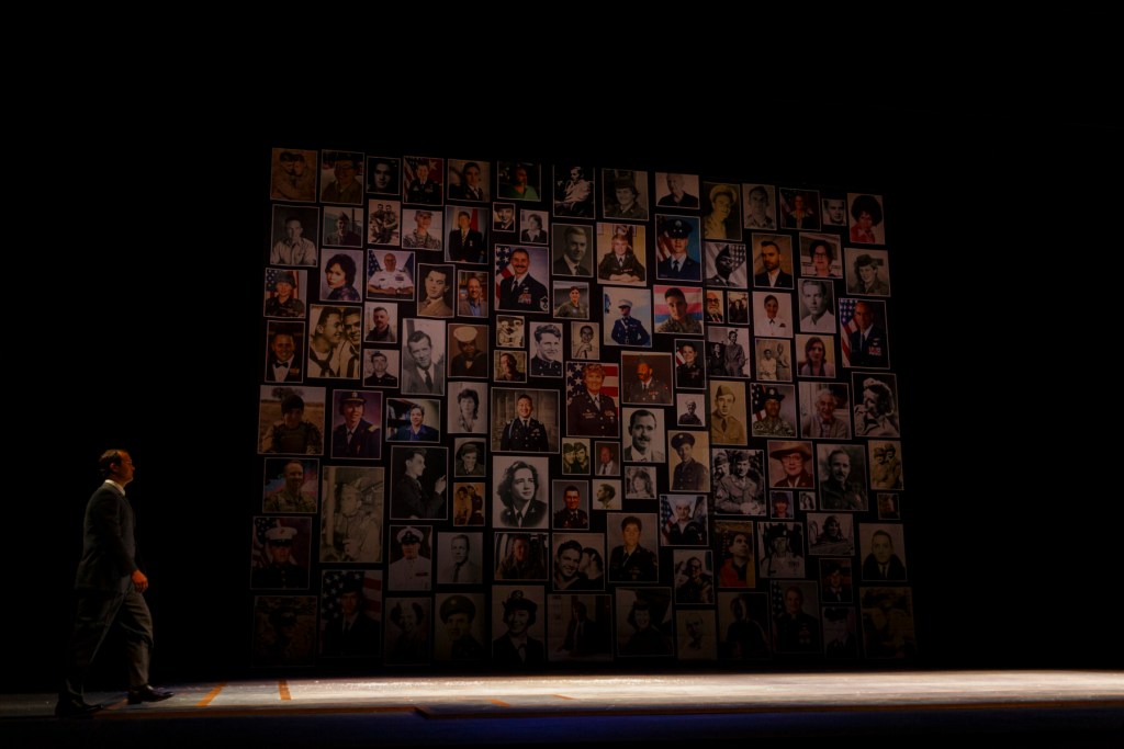 Photos of LGBTQ+ employees and service members who lost their jobs for being gay, collected as part of the Lavender Names Project in partnership with the American LGBTQ+ Museum and displayed at the end of "Fellow Travelers" at Seattle Opera. Photo: David Jaewon Oh.