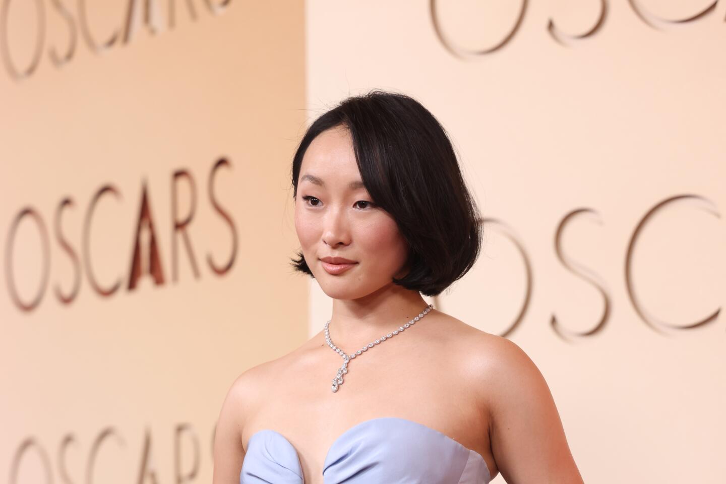 Ji-young Yoo arrives on the red carpet at the 98th Annual Academy Awards.