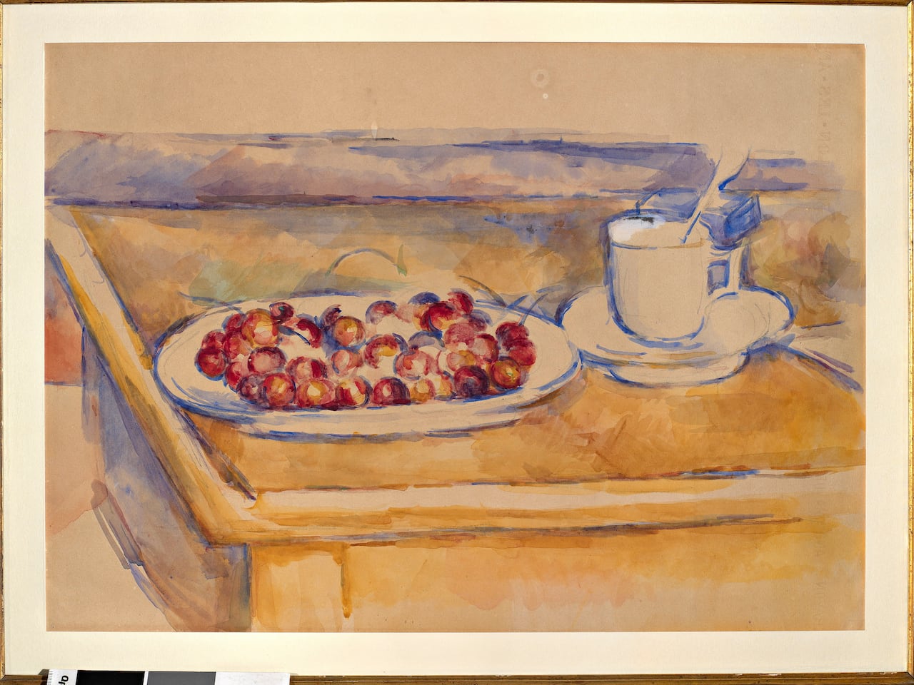 A handout picture of the painting Cup and Plate of Cherries by Paul Cézanne