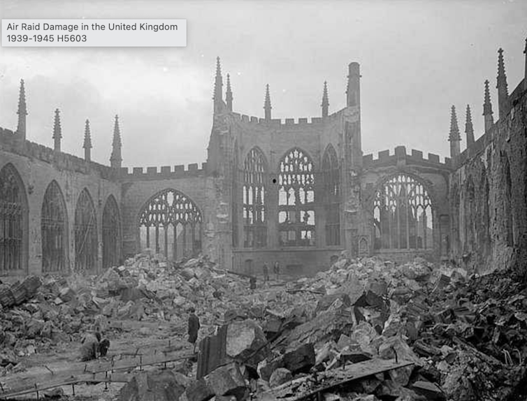 A black-and-white photo shows a destroyed cathedral.
