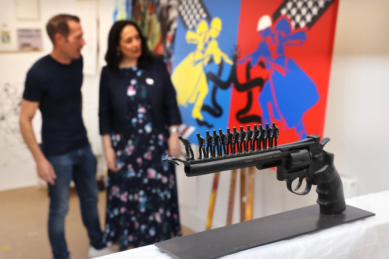 Artist Alan Mongey and then minister for culture and the arts Catherine Martin at the announcement of funding to deliver artist workspaces nationwide, in Artane Place Artist Workspaces, in 2024. Photograph: Dara Mac Dónaill