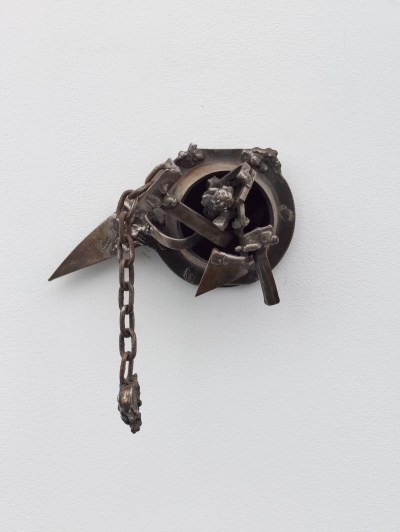 A steel assemblage that includes a dangling chain, a blade-like triangle, and a wheel-like form.