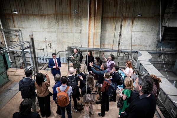 Matt Floca, the John F. Kennedy Center for the Performing Arts' new executive director and chief operating officer, shows aged equipment in the river pump room during a media tour intended to show building damage, Wednesday, April 22, 2026, in Washington. (AP Photo/Julia Demaree Nikhinson)