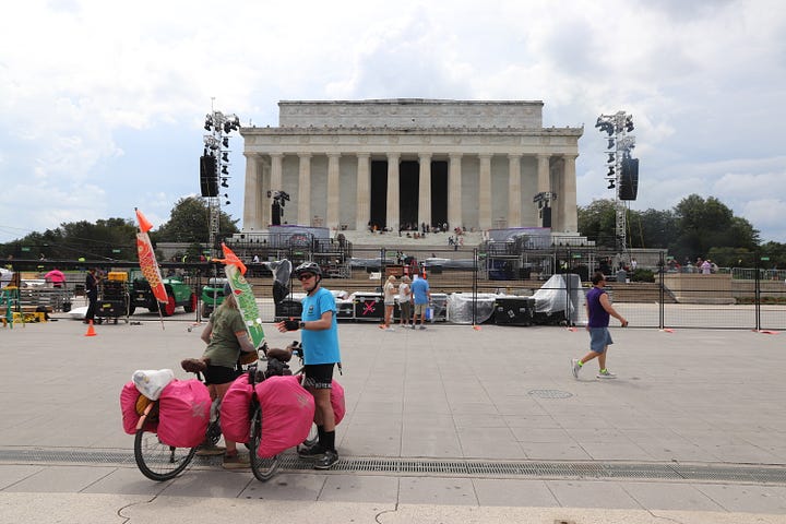 images of high fences streets blocked and a stage and video screens in front of the Lincoln Memorial
