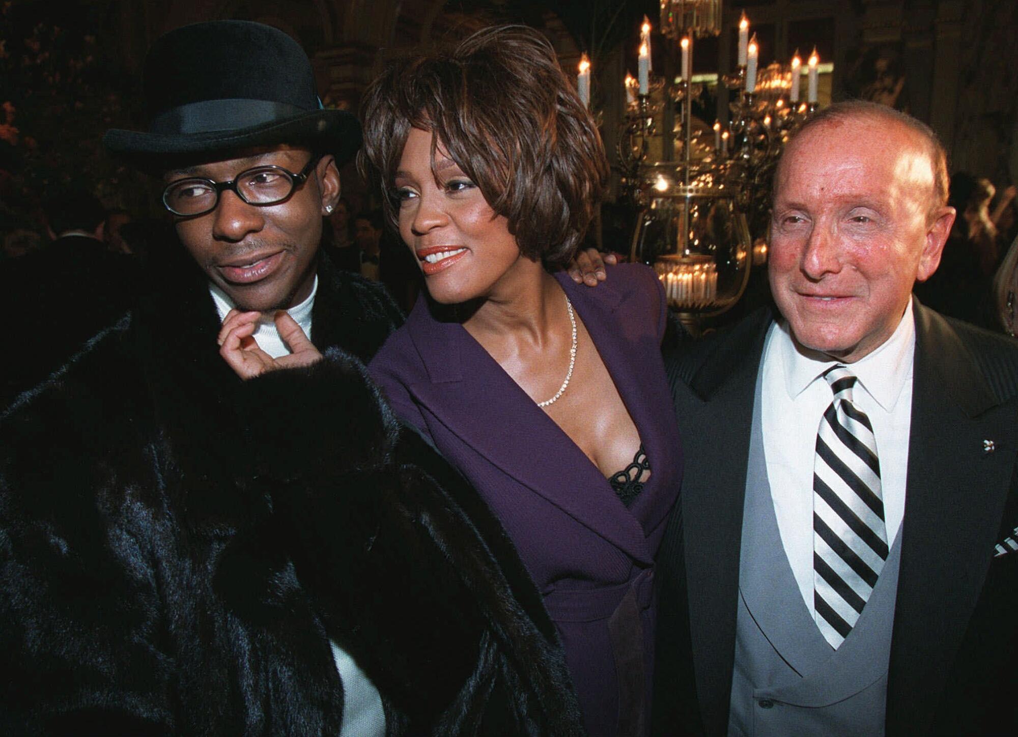Bobby Brown, from left, Whitney Houston and Clive Davis in New York in 1998.