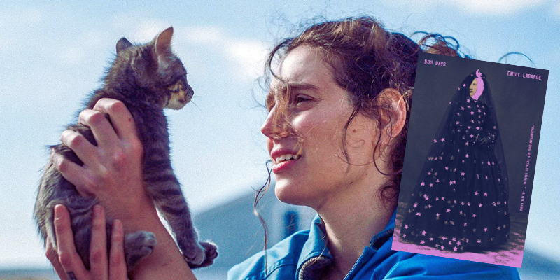 Eva Victor holds cat, the book Dog Days
