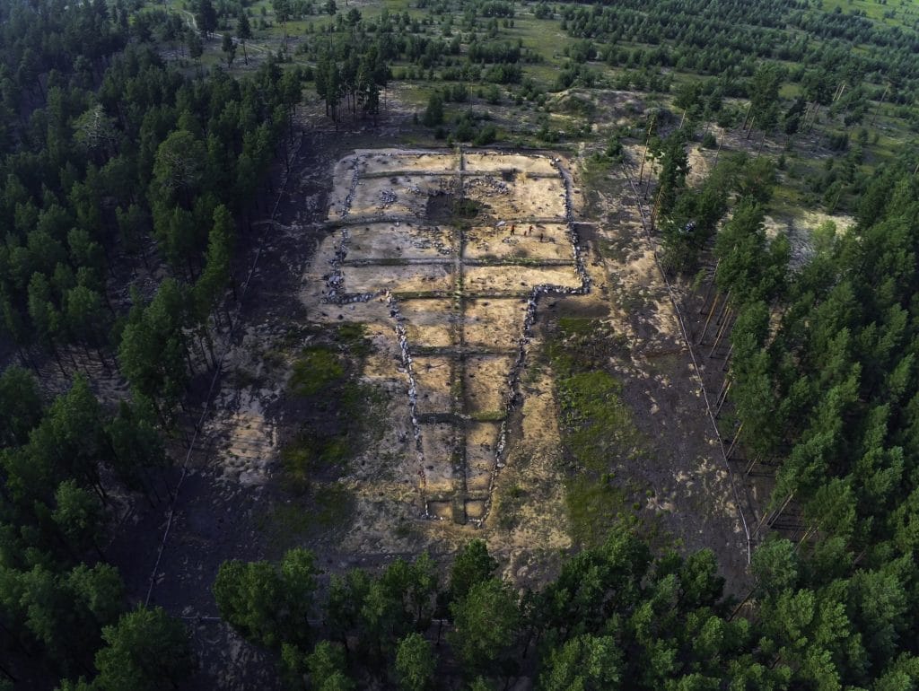 an aerial view of a tomb complex surrounded by forest in Mongolia that has been chosen by UNESCO in 2026