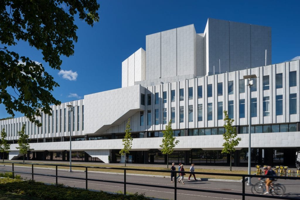 a modernist building against a blue sky background