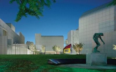 Exterior view of the High Museum of Art in Atlanta, showing its sculpture garden, including a Rodin at right.