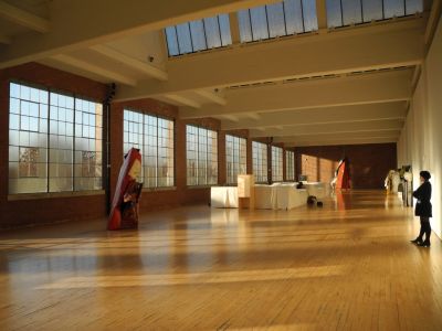 light-filled gallery with windows and skylights and a few large-scale sculptures