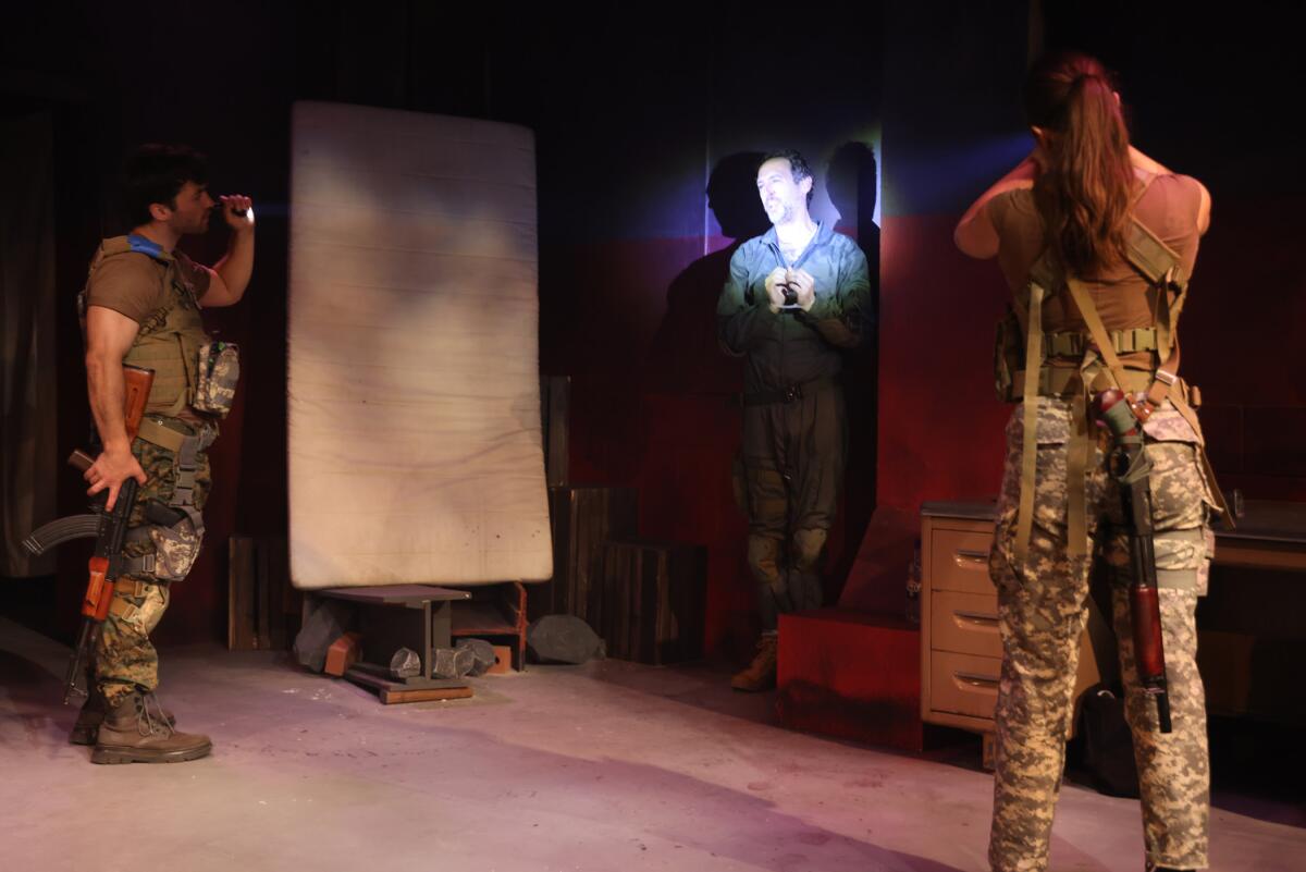 James Morris, from left, Christopher Reiling and Jasmine Kimiko in the play "Slava Ukraini! (or Waiting for Elon)."