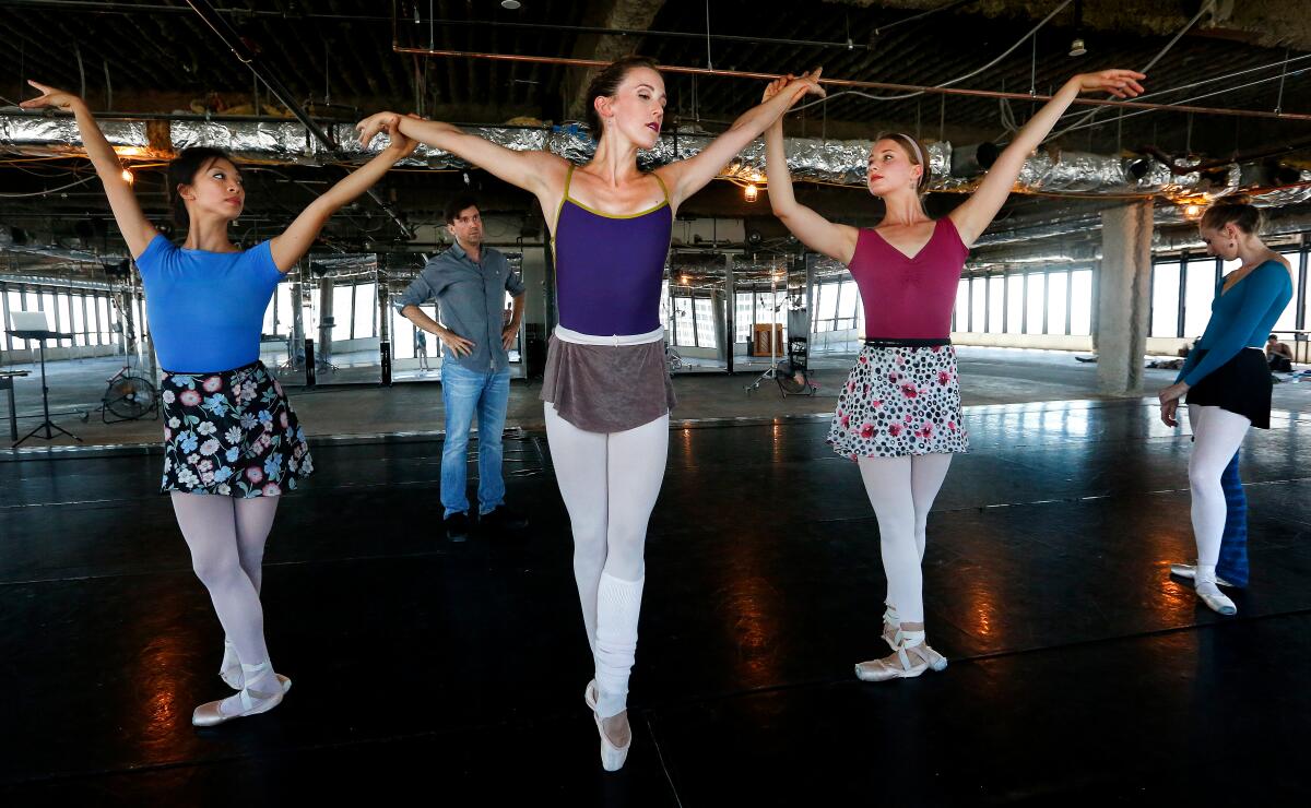 Rehearsal of a new work by choreographer Lincoln Jones, background, at the American Contemporary Ballet in DTLA in 2016.