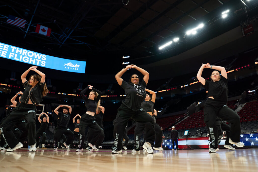 From left: Quinn, Lauren, Aidan, Nora, Autumn, Shar and Faith dance with the Firewerks. Photo courtesy of the Portland Fire