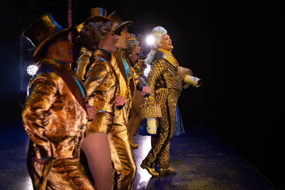 An actor onstage in a musical.