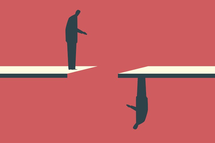 Graphic on a red background of a silhouetted businessman standing on a white ledge, looking across a gap at another businessman standing upside-down on an opposing ledge
