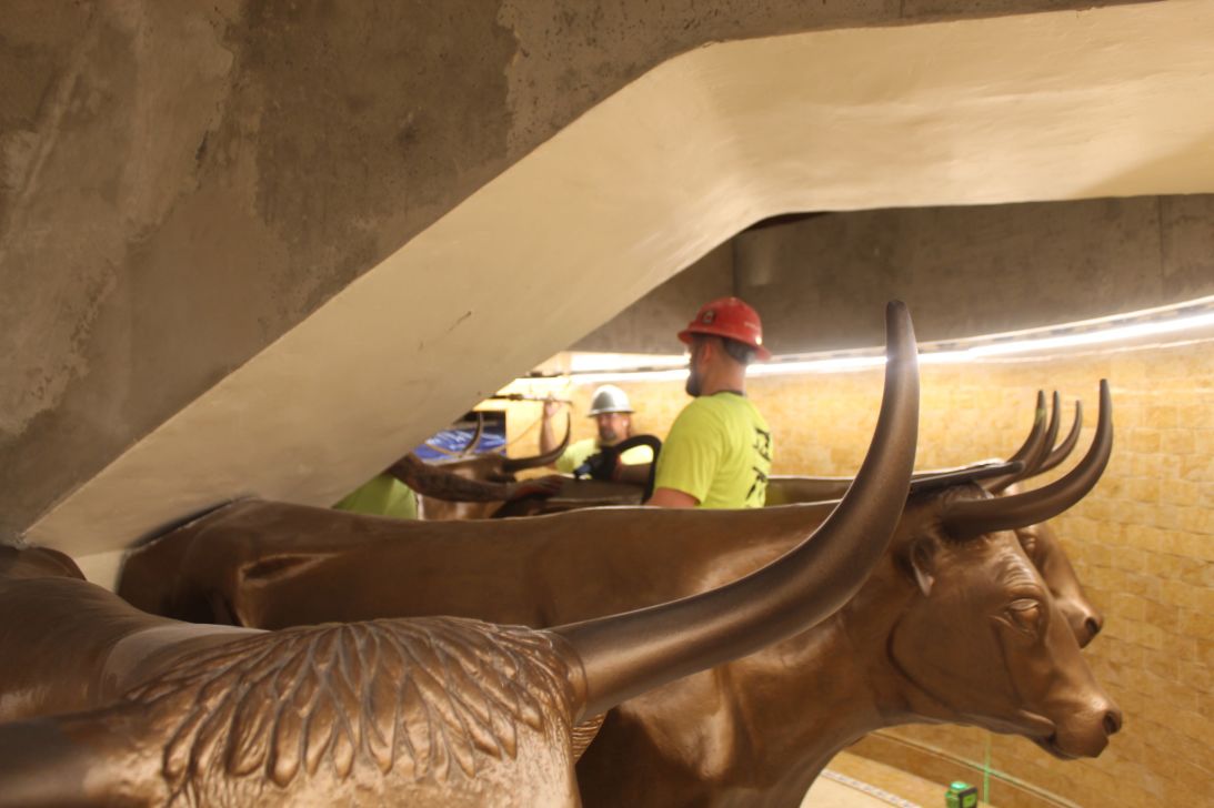 Original cast-iron oxen supporting the temple's east baptismal font are reinstalled on April 10, 2025, after undergoing restoration work.