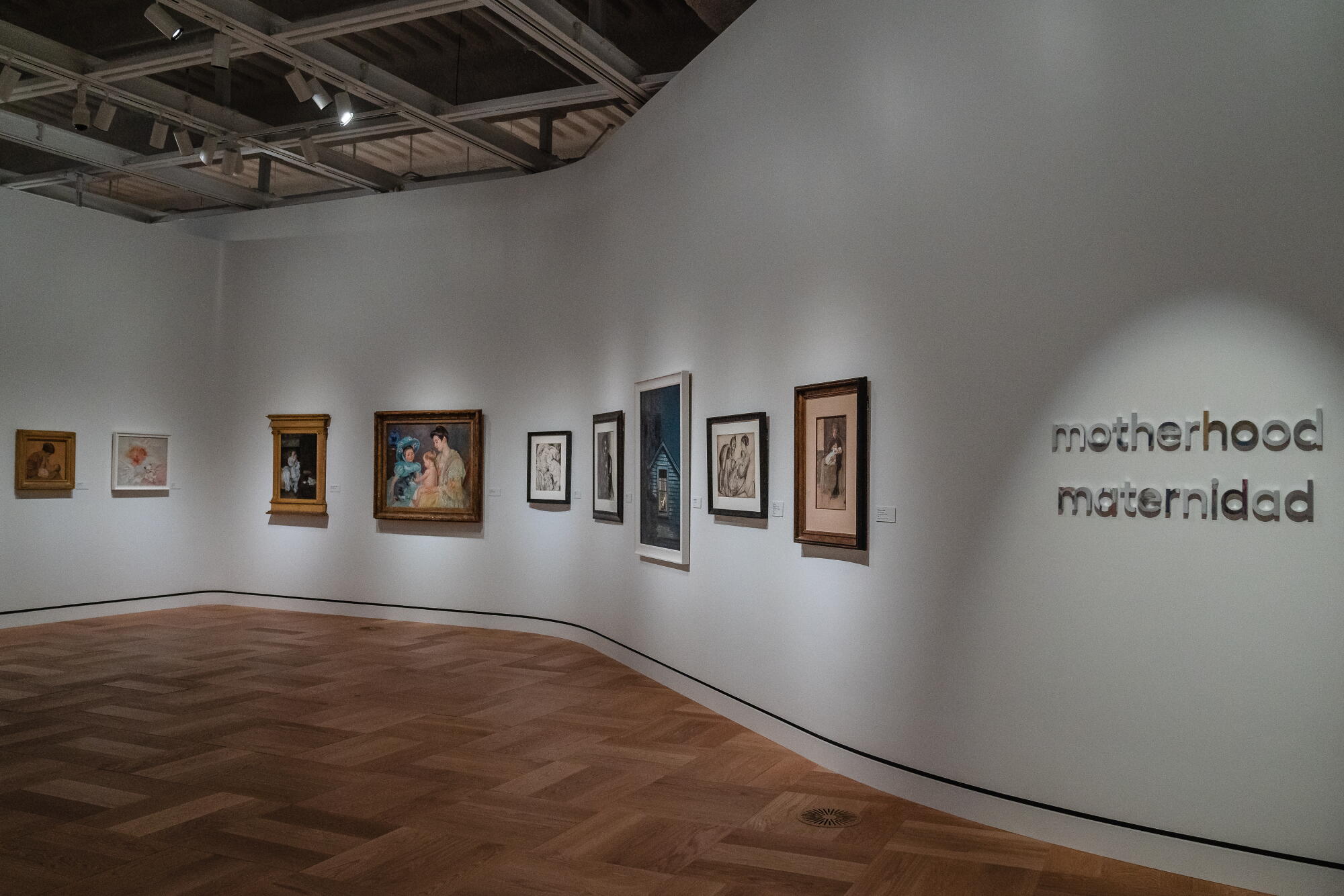 A gallery about "motherhood" inside a museum.