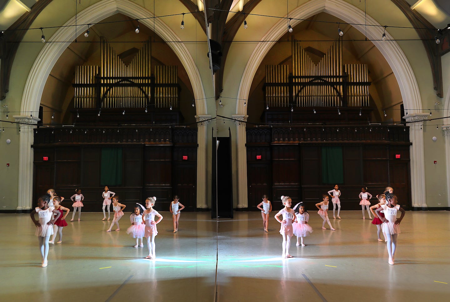 Dancers were reflected in a wall mirror as they auditioned.