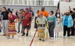 Dancers step to the drumbeat during the accessibility-focused special organized by Shawn Reynolds in the Fourth Annual South Sound Powwow on Sept. 26, 2026. Unlike in many other dances, participants
were allowed to use whatever accommodations they needed, including bringing a caregiver or support person and not wearing regalia.