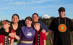 Shawn Reynolds (right) poses with his family (from left: Nakotah, Kailee, Cheyenne, Lisa and Dakotah Reynolds) outside Graham’s Bethel High School during the South Sound Powwow on Sept. 26, 2026. Reynolds’ three youngest kids — Cheyenne, Dakotah and Nakotah — are all autistic, and he said it’s a gift to see them participate in powwows.