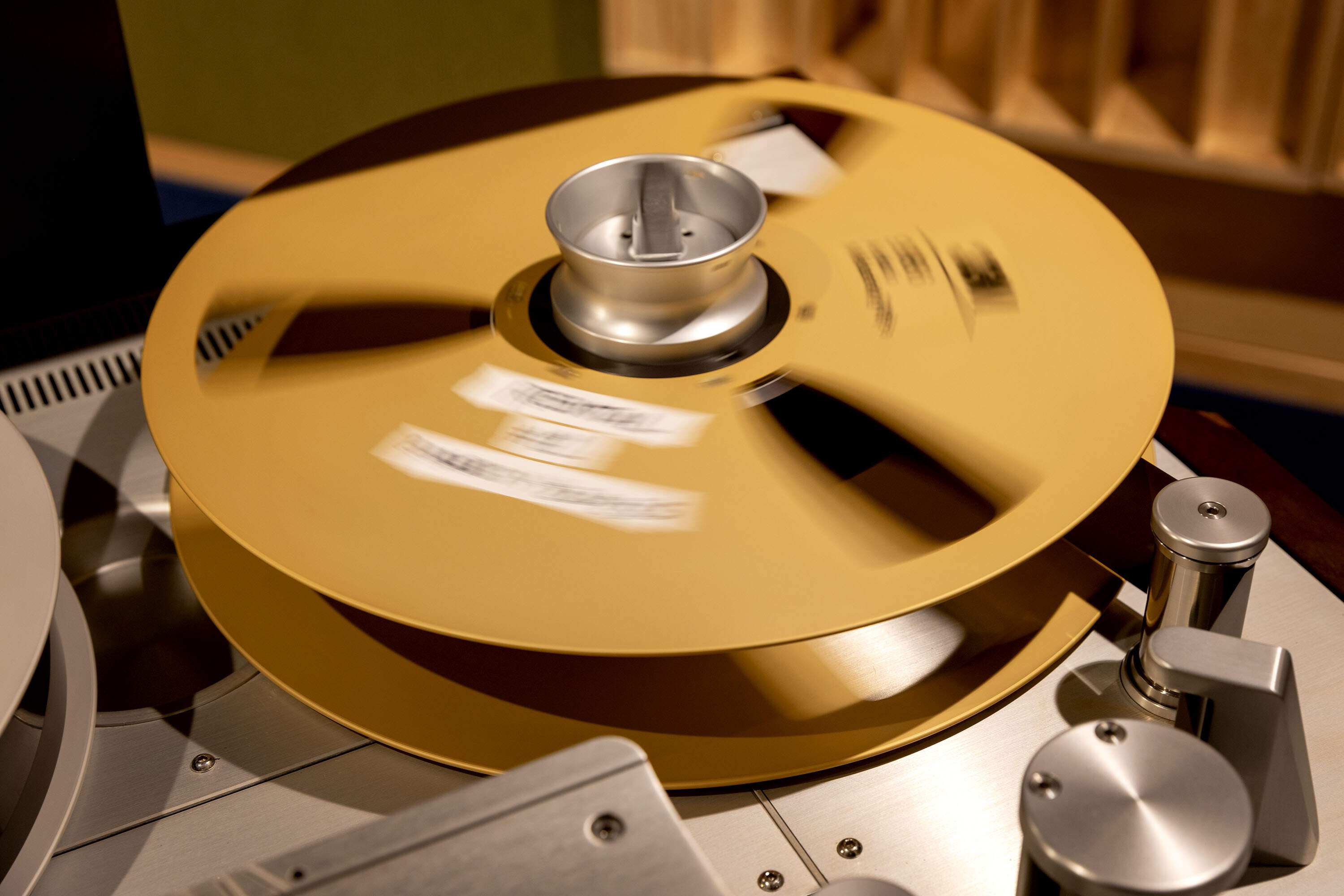 A 24 track tape spool spins on a 24 Studer track recorder at Q Division recording studios in Cambridge, Mass. (Robin Lubbock/WBUR)